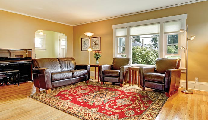 A rug on wooden floor in a room