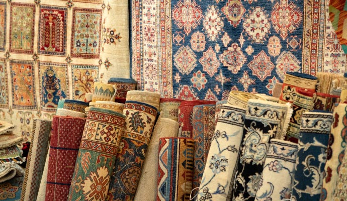 a collection of rolled up oriental rugs