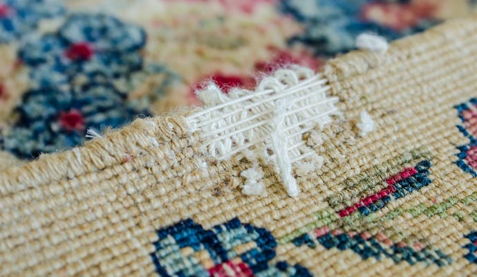 closeup view of a damaged rug