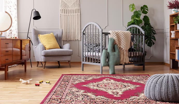 an oriental rug in a baby room